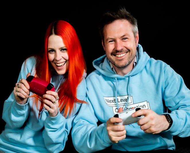 jess rowlings and dr matt harrison together holding game controllers smiling homepage